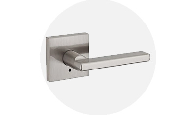 Kwikset Residential Lever product isolated on top of a gray circle